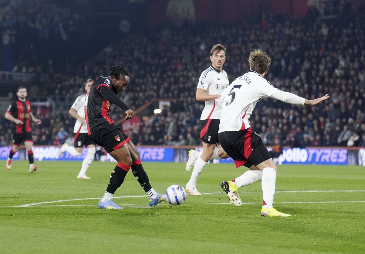 Bournemouth's Antoine Semenyo, center left, scores their side's first goal of the game during the English Premier League soccer match between Bournemouth and Fulham at the Vitality Stadium, Bournemouth, England, Monday, April 14, 2025. (John Walton/PA via AP)