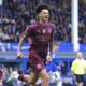 Manchester City's Nico O'Reilly celebrates scoring during the English Premier League soccer match between Everton and Manchester City at Goodison Park, Liverpool, England, Saturday April 19, 2025. (Peter Byrne/PA via AP)