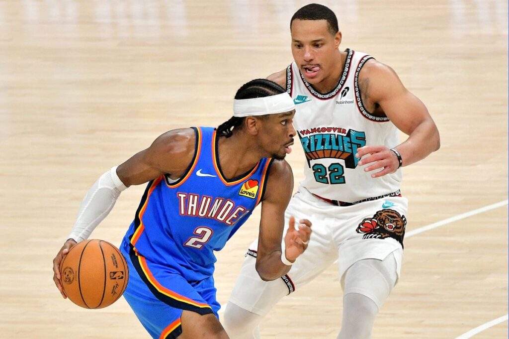 Oklahoma City Thunder guard Shai Gilgeous-Alexander (2) handles the ball against Memphis Grizzlies guard Desmond Bane (22) in the second half of Game 3 of an NBA first-round playoff series Thursday, April 24, 2025, in Memphis, Tenn. (AP Photo/Brandon Dill)