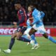 Bologna's Tommaso Corazza, left, fights for the ball with Napoli's Frank Anguissa during the Italian Serie A soccer match between Bologna F..C and S.S.C. Napoli at Renato Dall'Ara Stadium, Bologna, Italy, Monday, April 7, 2025. (Michele Nucci/LaPresse via AP)
