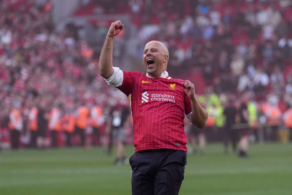 Liverpool's manager Arne Slot celebrates after winning the English Premier League soccer match between Liverpool and Tottenham Hotspur and clinching the Premier League title at Anfield in Liverpool, England, Sunday, April 27, 2025. (AP Photo/Jon Super)