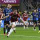 AC Milan's Luka Jovic celebrates after scoring during the Italian Cup semifinal second leg soccer match between Inter Milan and AC Milan at the San Siro stadium in Milan, Italy, Wednesday, April 23, 2025. (AP Photo/Luca Bruno)