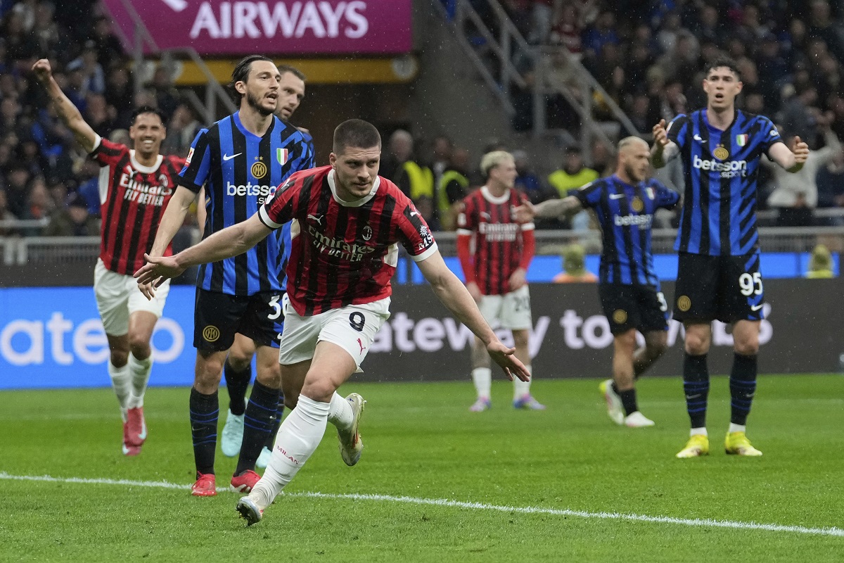 AC Milan's Luka Jovic celebrates after scoring during the Italian Cup semifinal second leg soccer match between Inter Milan and AC Milan at the San Siro stadium in Milan, Italy, Wednesday, April 23, 2025. (AP Photo/Luca Bruno)