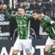 Werder's Oliver Burke, right, celebrates with Romano Schmid after scoring his side's first goal during the Bundesliga soccer match between Werder Bremen and Eintracht Frankfurt at the Weser Stadium in Bremen, Saturday, April 5, 2025. (Carmen Jaspersen/dpa via AP)