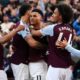 Aston Villa's Ollie Watkins, center, celebrates scoring with teammates during the English Premier League soccer match between Aston Villa and Newcastle United at Villa Park, Birmingham, England, Saturday April 19, 2025. (David Davies/PA via AP)