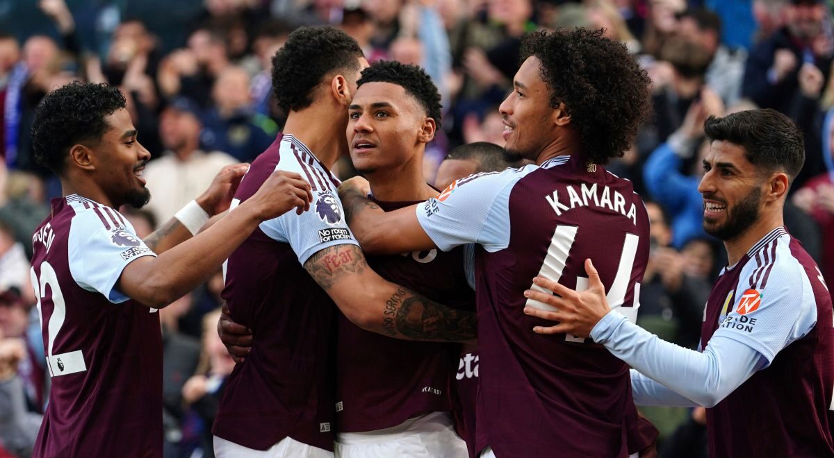Aston Villa's Ollie Watkins, center, celebrates scoring with teammates during the English Premier League soccer match between Aston Villa and Newcastle United at Villa Park, Birmingham, England, Saturday April 19, 2025. (David Davies/PA via AP)