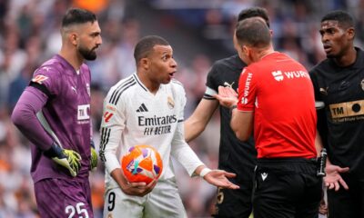 eal Madrid's Kylian Mbappe, center, argues with the referee Guillermo Cuadra during a Spanish La Liga soccer match between Real Madrid and Valencia at the Santiago Bernabeu stadium in Madrid, Spain, Saturday, April 5, 2025. (AP Photo/Manu Fernandez)