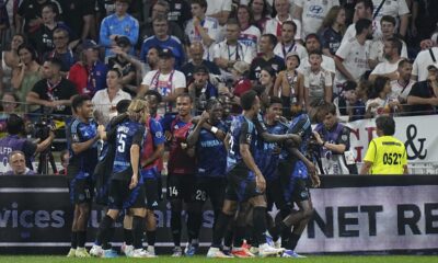 FILE - Strasbourg players celebrate after Strasbourg's Emanuel Emegha scored his side's third goal during the French League One soccer match between Lyon and Strasbourg at the Groupama stadium in Decines, outside Lyon, France, Friday, Aug. 30, 2024. (AP Photo/Laurent Cipriani, file)