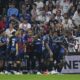 FILE - Strasbourg players celebrate after Strasbourg's Emanuel Emegha scored his side's third goal during the French League One soccer match between Lyon and Strasbourg at the Groupama stadium in Decines, outside Lyon, France, Friday, Aug. 30, 2024. (AP Photo/Laurent Cipriani, file)