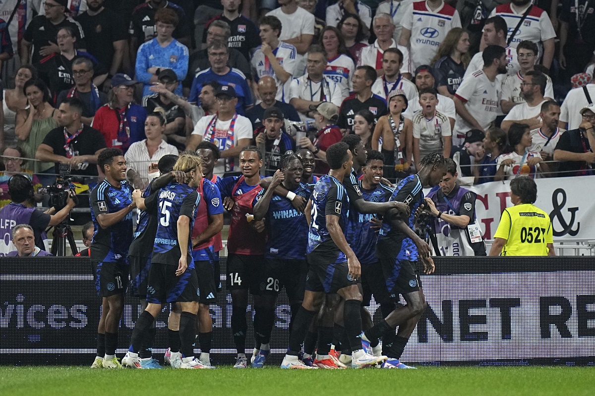 FILE - Strasbourg players celebrate after Strasbourg's Emanuel Emegha scored his side's third goal during the French League One soccer match between Lyon and Strasbourg at the Groupama stadium in Decines, outside Lyon, France, Friday, Aug. 30, 2024. (AP Photo/Laurent Cipriani, file)