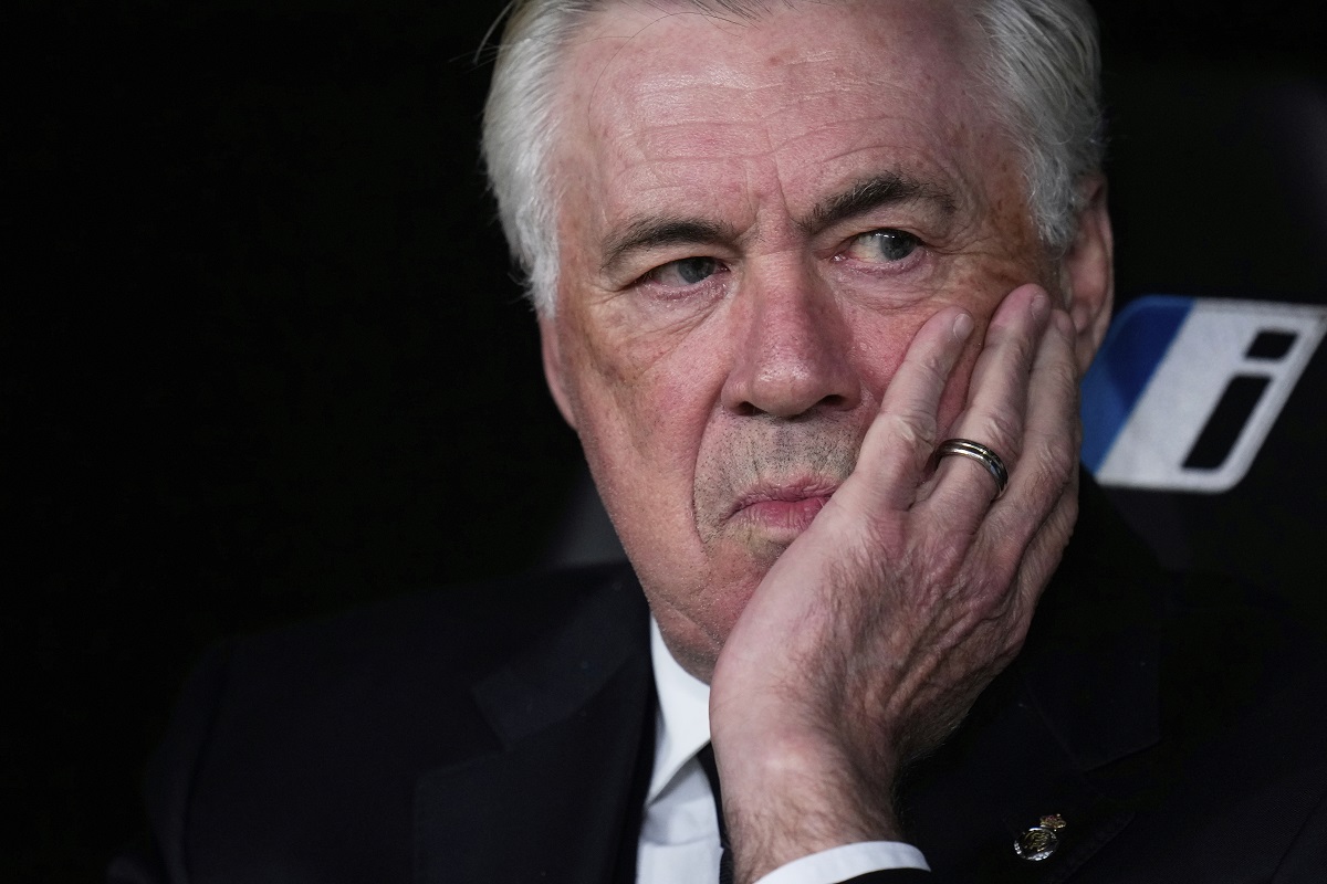 Real Madrid's head coach Carlo Ancelotti sits on the bench prior to the Spanish La Liga soccer match between Real Madrid and Athletic Bilbao at the Santiago Bernabeu stadium in Madrid, Sunday, April 20, 2025. (AP Photo/Manu Fernandez)