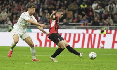 AC Milan's Luka Jovic scores his side's second goal during the Italian Serie A soccer match between AC Milan and Fiorentina at the San Siro Stadium in Milan, Italy, Saturday, April 5, 2025. (AP Photo/Antonio Calanni)