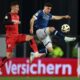 Leverkusen's Patrik Schick, left, and Bielefeld's Stefano Russo fight for the ball during the German soccer cup, DFB Pokal, semi-final soccer match between Arminia Bielefeld and Bayer Leverkusen in Bielefeld, Germany, Tuesday, April 1, 2025. (Friso Gentsch/dpa via AP)