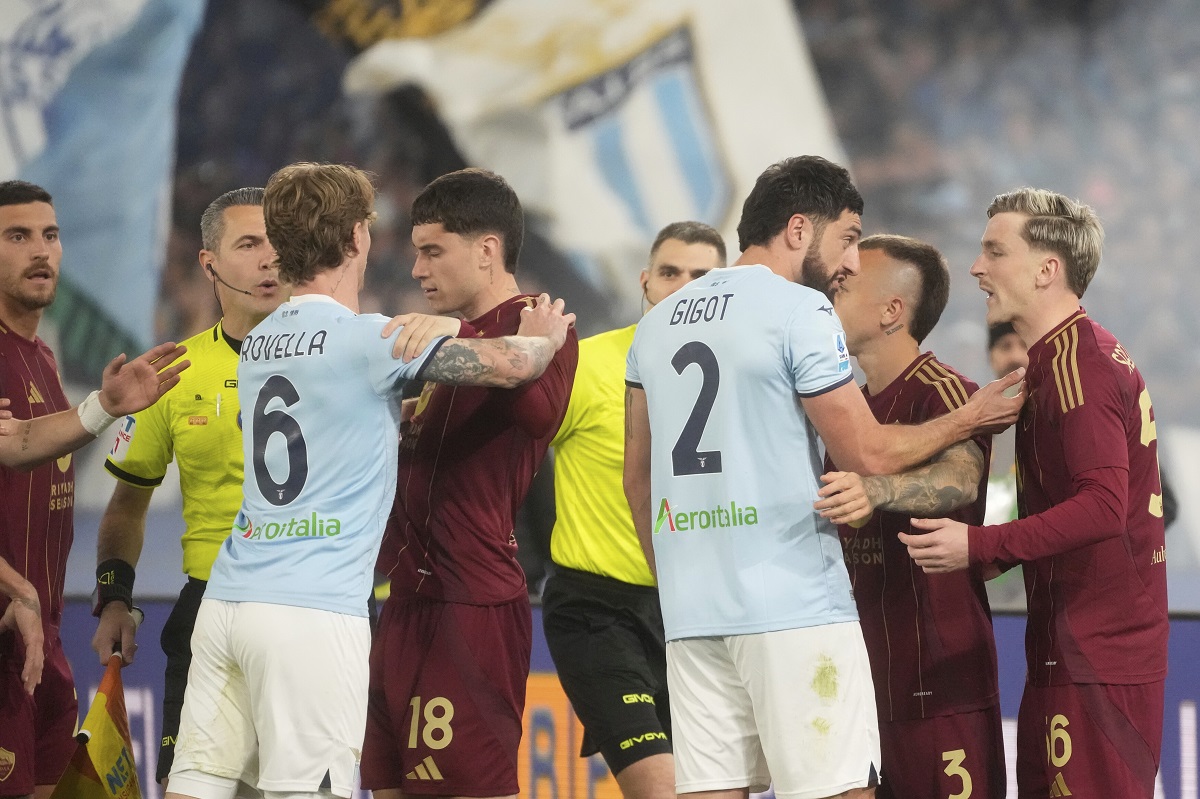 Players argue during the Italian Serie A soccer match between Lazio and Roma at Rome's Olympic stadium, Sunday, April 13, 2025. (AP Photo/Gregorio Borgia)