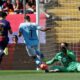 Barcelona's Pau Cubarsi, left, challenges for the ball with Celta's Borja Iglesias during a Spanish La Liga soccer match between Barcelona and Celta de Vigo at the Lluis Companys Olympic stadium in Barcelona, Spain, Saturday, April 19, 2025. (AP Photo/Joan Monfort)