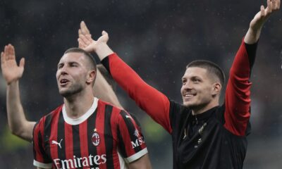 AC Milan's Strahinja Pavlovic, left, and Luka Jovic celebrate after the Italian Cup semifinal second leg soccer match between Inter Milan and AC Milan at the San Siro stadium in Milan, Italy, Wednesday, April 23, 2025. (AP Photo/Luca Bruno)