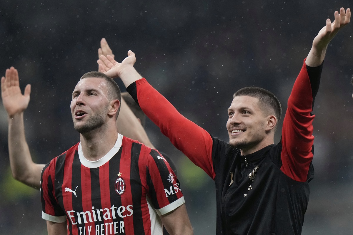 AC Milan's Strahinja Pavlovic, left, and Luka Jovic celebrate after the Italian Cup semifinal second leg soccer match between Inter Milan and AC Milan at the San Siro stadium in Milan, Italy, Wednesday, April 23, 2025. (AP Photo/Luca Bruno)