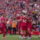 Liverpool's Alexis Mac Allister, right, celebrates with teammates after scoring his side's second goal during the English Premier League soccer match between Liverpool and Tottenham Hotspur at Anfield in Liverpool, England, Sunday, April 27, 2025. (AP Photo/Jon Super)