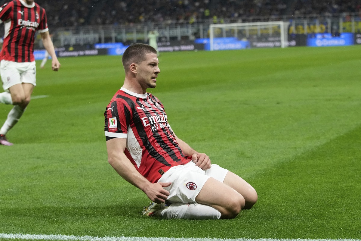 AC Milan's Luka Jovic, front, celebrates after scoring during the Italian Cup semifinal second leg soccer match between Inter Milan and AC Milan at the San Siro stadium in Milan, Italy, Wednesday, April 23, 2025. (AP Photo/Luca Bruno)