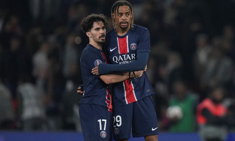 PSG's Vitinha, left, and Bradley Barcola stand. dejected after the League One soccer match between PSG and Nice in Paris Friday, April 25, 2025. (AP Photo/Thibault Camus)