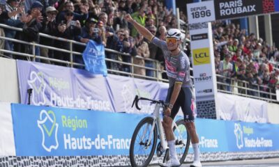 Mathieu van der Poel, of the Netherlands, celebrates as he crosses the finish line to win the Paris-Roubaix cycling race in Roubaix, France, Sunday, April 13, 2025. (AP Photo/Thibault Camus)