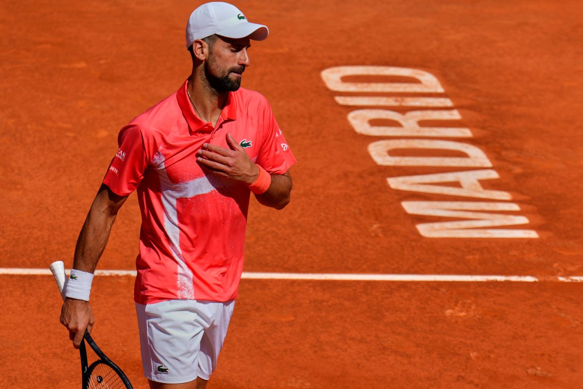 Novak Djokovic of Serbia competes against Matteo Arnaldi of Italy at the Madrid Open tennis tournament in Madrid, Spain, Saturday, April 26, 2025. (AP Photo/Manu Fernandez)