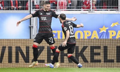 Berlin's Andrej Ilic, left, and Berlin's Josip Juranovic after scoring their side's second goal during the German Bundesliga soccer match between SC Freiburg - 1. FC Union Berlin at The Europa-Park Stadion in Freiburg, Germany, Sunday, March 30, 2025. (Harry Langer/dpa via AP)
