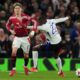 Lyon's Clinton Mata, right, and Manchester United's Alejandro Garnacho challenge for the ball during the Europa League quarter final second leg soccer match between Manchester United and Olympique Lyon in Manchester, Britain, Thursday, April 17, 2025. (AP Photo/Jon Super)