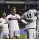 Bologna's Thijs Dallinga, second left, scores their side's third goal of the game during the Italian Cup, semi-final, first leg soccer match between Empoli and Bologna at the Renato Castellani stadium, in Empoli, Italy, Tuesday April 1, 2025. (Marco Bucco/LaPresse via AP)