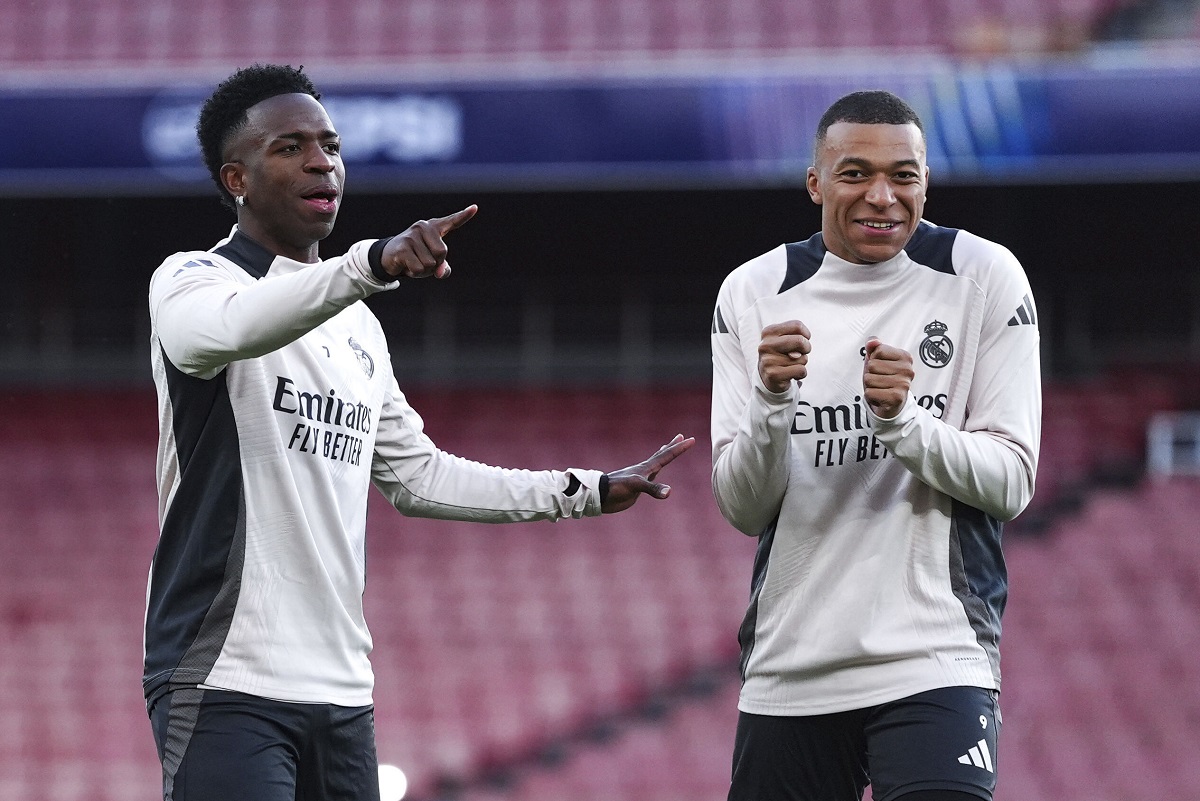 Real Madrid's Vinicius Junior and Kylian Mbappe react, during a training session at the Emirates Stadium, in London, Monday April 7, 2025, a day ahead of the 1st leg Champions League soccer match against Arsenal on Tuesday. (Bradley Collyer/PA via AP)