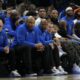 Milwaukee Bucks' Giannis Antetokounmpo and Damian Lillard watch from the bench during the first half of an NBA basketball game against the Detroit Pistons, Sunday, April 13, 2025, in Milwaukee. (AP Photo/Aaron Gash)