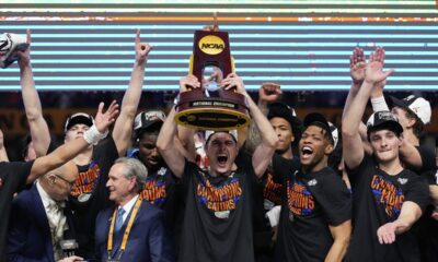 Florida celebrates with the trophy after their win against the Houston in the national championship at the Final Four of the NCAA college basketball tournament, Monday, April 7, 2025, in San Antonio. (AP Photo/Brynn Anderson)