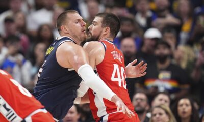 Denver Nuggets center Nikola Jokic, left, moves past Los Angeles Clippers center Ivica Zubac in the second half of Game 2 of a first-round NBA playoff series Monday, April 21, 2025, in Denver. (AP Photo/David Zalubowski)