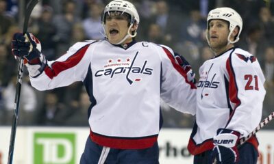 FILE - Washington Capitals Alexander Ovechkin, left, celebrates scoring his 300th NHL career goal with teammate Brooks Laich (21) during first period of an NHL hockey game against the Toronto Maple Leafs, Tuesday, April 5, 2011, in Toronto. (Frank Gunn/The Canadian Press via AP, FIle)