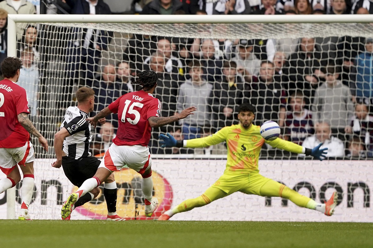 Newcastle United's Harvey Barnes, second left, scores his side's third goal during the English Premier League soccer match between Newcastle United and Manchester United in Newcastle upon Tyne, England, Sunday, April 13, 2025. (Owen Humphreys/PA via AP)