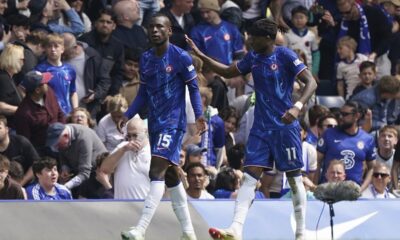 Chelsea's Nicolas Jackson, left, celebrates with Noni Madueke after scoring his side's first goal of the game during the Premier League match between Chelsea and Everton at Stamford Bridge, London, Saturday April 26, 2025. (Jonathan Brady/PA via AP)