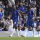Chelsea's Nicolas Jackson, left, celebrates with Noni Madueke after scoring his side's first goal of the game during the Premier League match between Chelsea and Everton at Stamford Bridge, London, Saturday April 26, 2025. (Jonathan Brady/PA via AP)