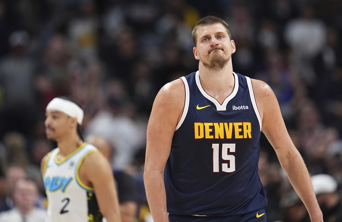 Denver Nuggets center Nikola Jokic reacts after missing last-second, 3-point basket- attempt in the second half of an NBA basketball game against the Indiana Pacers, Sunday, April 6, 2025, in Denver. (AP Photo/David Zalubowski)