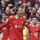 Liverpool's Virgil van Dijk celebrates after scoring his side's second goal during the English Premier League soccer match between Liverpool and West Ham United at Anfield in Liverpool, Sunday, April 13, 2025. (AP Photo/Ian Hodgson)