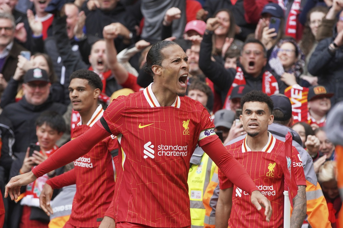 Liverpool's Virgil van Dijk celebrates after scoring his side's second goal during the English Premier League soccer match between Liverpool and West Ham United at Anfield in Liverpool, Sunday, April 13, 2025. (AP Photo/Ian Hodgson)