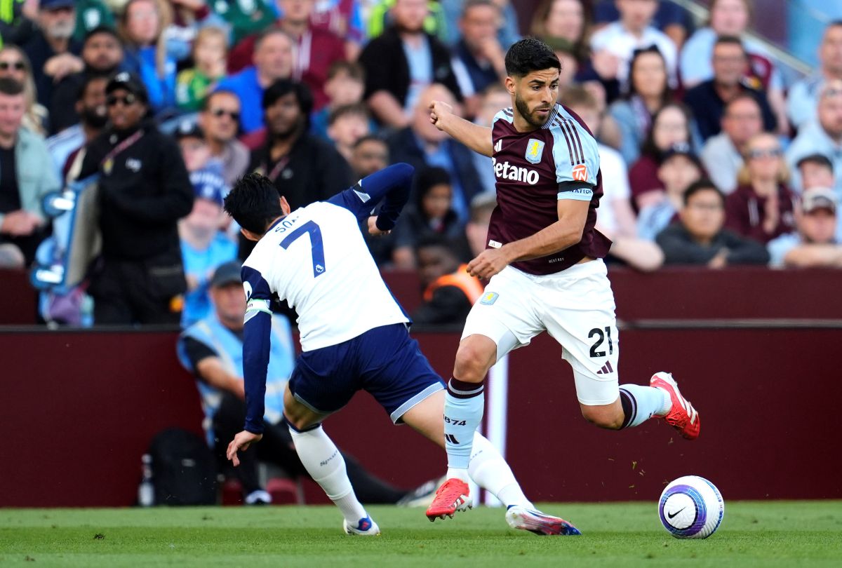 Tottenham Hotspur's Son Heung-Min, left, and Aston Villa's Marco Asensio battle for the ball during the English Premier League soccer match between Aston Villa and Tottenham Hotspur at Villa Park, Birmingham, England, Friday, May 16, 2025. (Nick Potts/PA via AP)