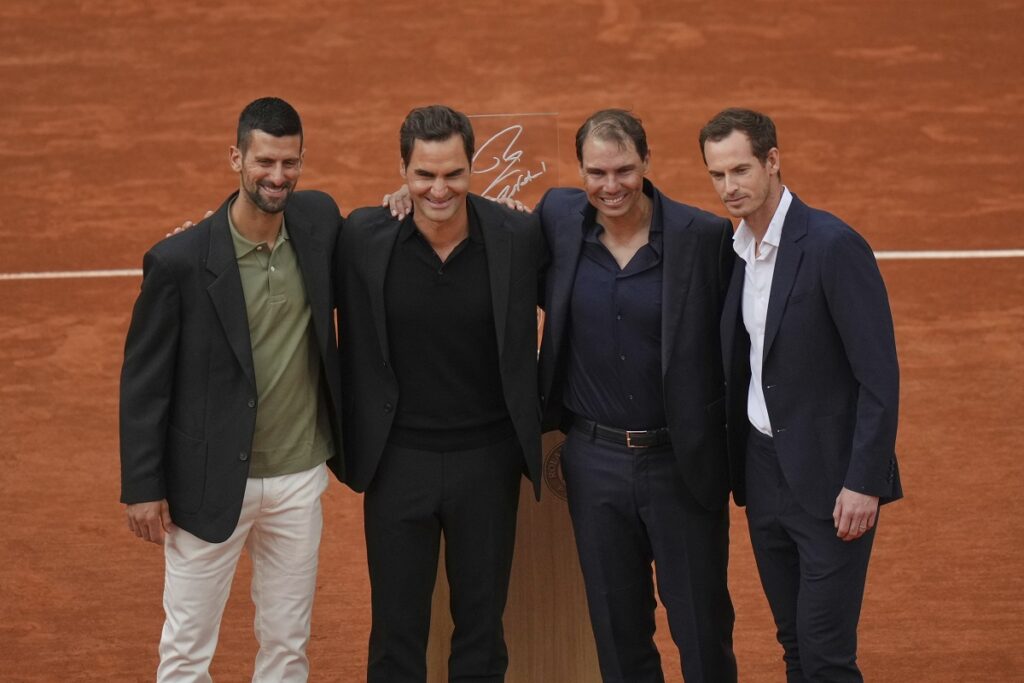 Rafa Nadal, second right, poses with, from left, Novak Djokovic, Roger Federer and Andy Murray, right, during a farewell ceremony at center court Philippe-Chatrier, at the Roland-Garros stadium, in Paris, Sunday May 25, 2025. (AP Photo/Thibault Camus)