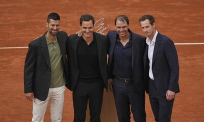 Rafa Nadal, second right, poses with, from left, Novak Djokovic, Roger Federer and Andy Murray, right, during a farewell ceremony at center court Philippe-Chatrier, at the Roland-Garros stadium, in Paris, Sunday May 25, 2025. (AP Photo/Thibault Camus)