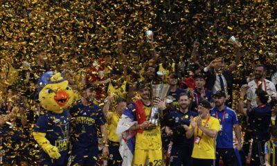 Fenerbahce's Marko Guduric holds the trophy as they celebrate winning the Euroleague final basketball match between Monaco and Fenerbahce in Abu Dhabi, United Arab Emirates, Sunday, May 25, 2025. (AP Photo/Altaf Qadri)
