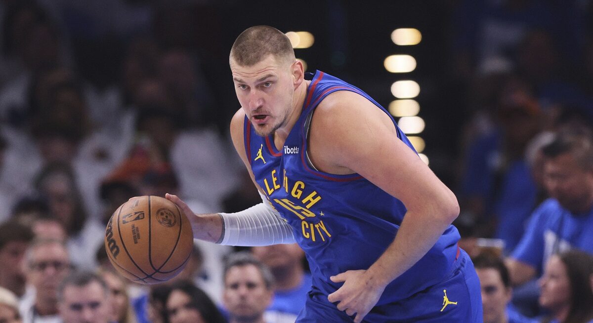Denver Nuggets center Nikola Jokic advances the ball upcourt against the Oklahoma City Thunder in the first half of Game 5 of an NBA basketball second-round playoff series Tuesday, May 13, 2025, in Oklahoma City. (AP Photo/Nate Billings)