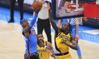 Oklahoma City Thunder guard Shai Gilgeous-Alexander (2) shoots against Indiana Pacers forward Aaron Nesmith (23) during the second half of Game 2 of the NBA Finals basketball series Sunday, June 8, 2025, in Oklahoma City. (AP Photo/Kyle Phillips)