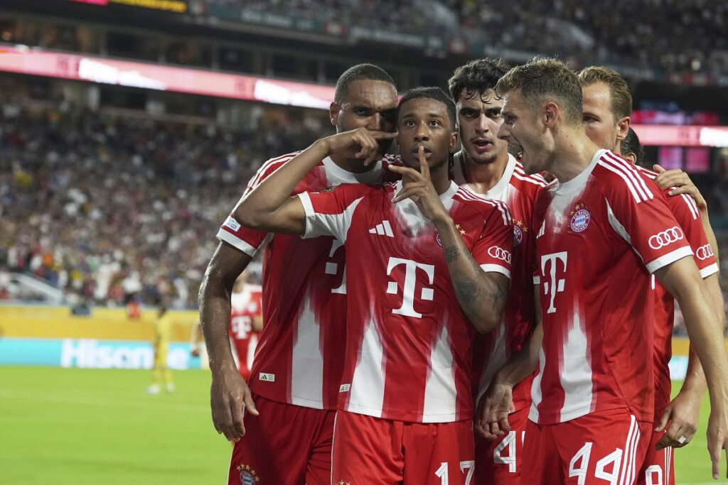 Bayern Munich's Michael Olise, second from left, celebrates scoring his side's 2nd goal during the Club World Cup Group C soccer match between Bayern Munich and Boca Juniors in Miami Gardens, Fla., Friday, June 20, 2025. (AP Photo/Rebecca Blackwell)
