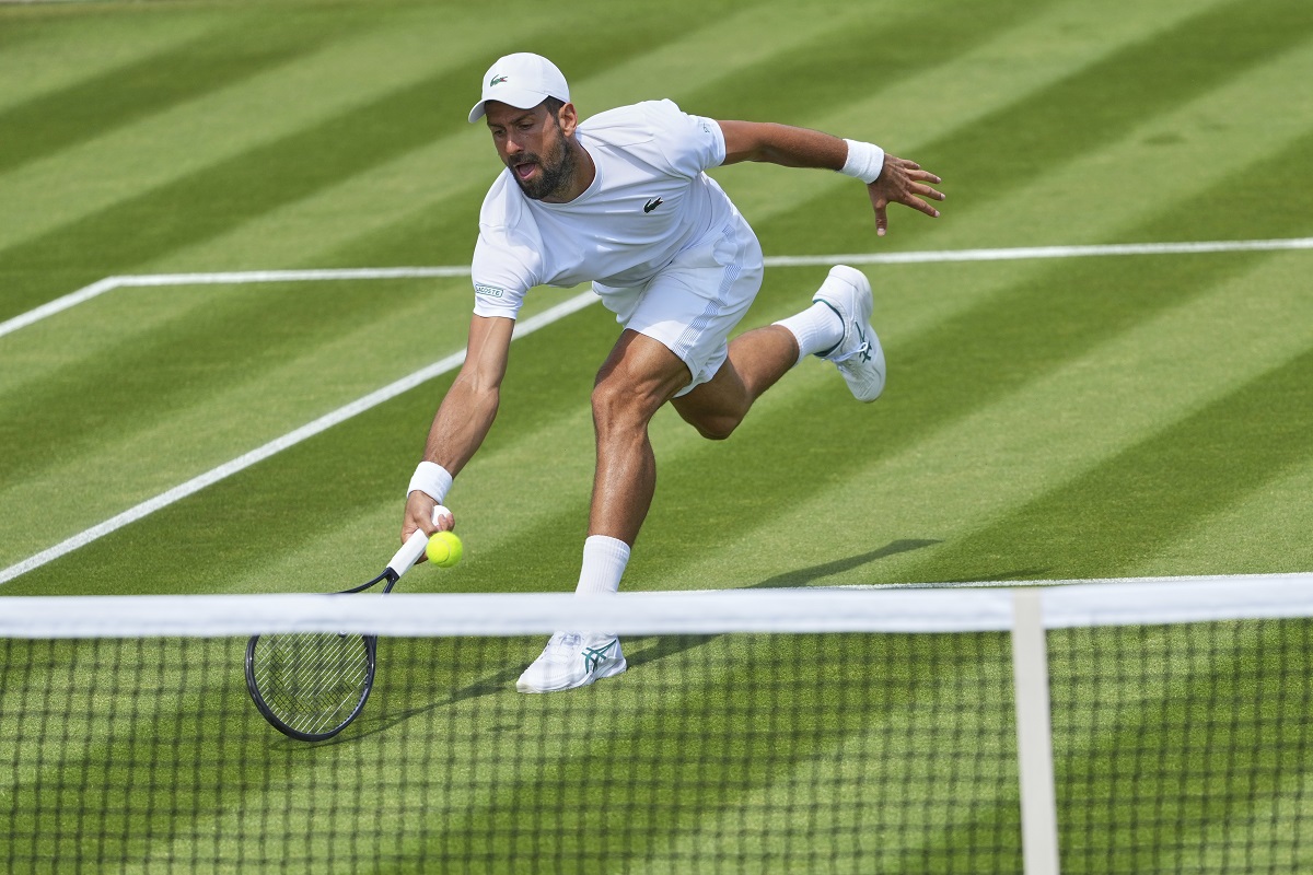 Novak Djokovic of Serbia plays a return during a practice session at the All England Lawn Tennis and Croquet Club, ahead of the Wimbledon Championships in London, Wednesday, June 25, 2025. (AP Photo/Kirsty Wigglesworth)
