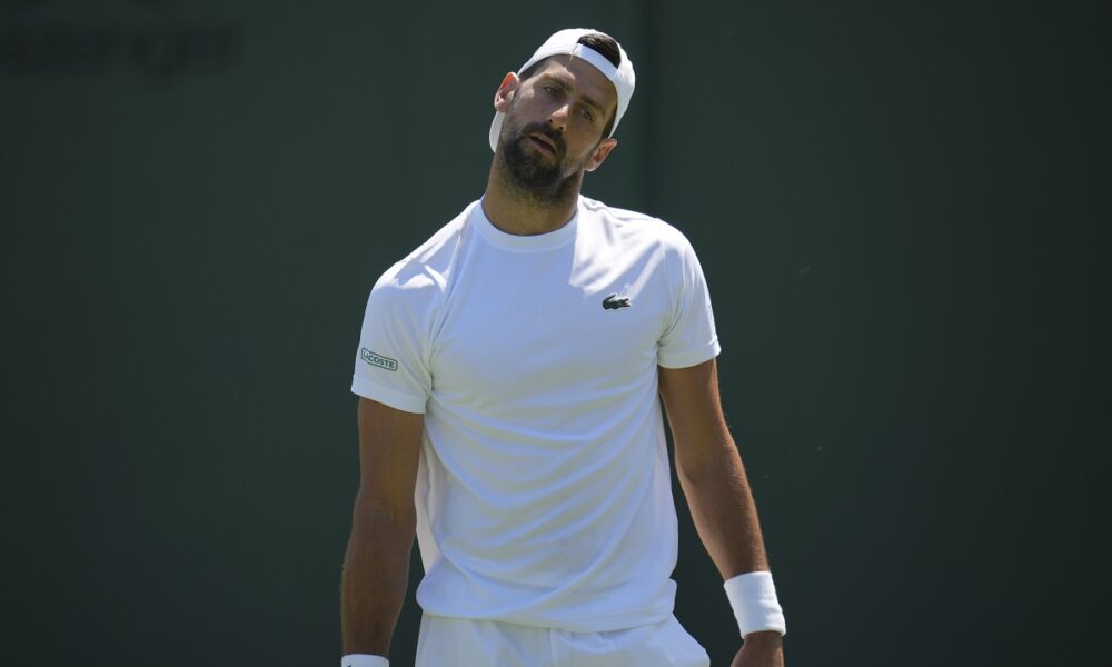 Novak Djokovic of Serbia attends a practice session ahead of the Wimbledon Championships in London, Friday, June 27, 2025. (AP Photo/Kin Cheung)