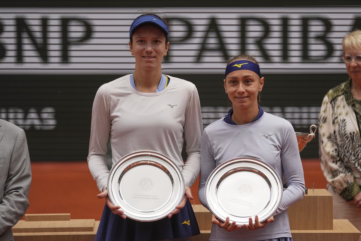 Second placed Kazakhstan Anna Danilina, left, and Serbia's Aleksandra Krunic pose with their trophies after the women's doubles final match of the French Tennis Open against winners Italy's Jasmine Paolini and Sara Errani at the Roland-Garros stadium in Paris, Sunday, June 8, 2025. (AP Photo/Thibault Camus)